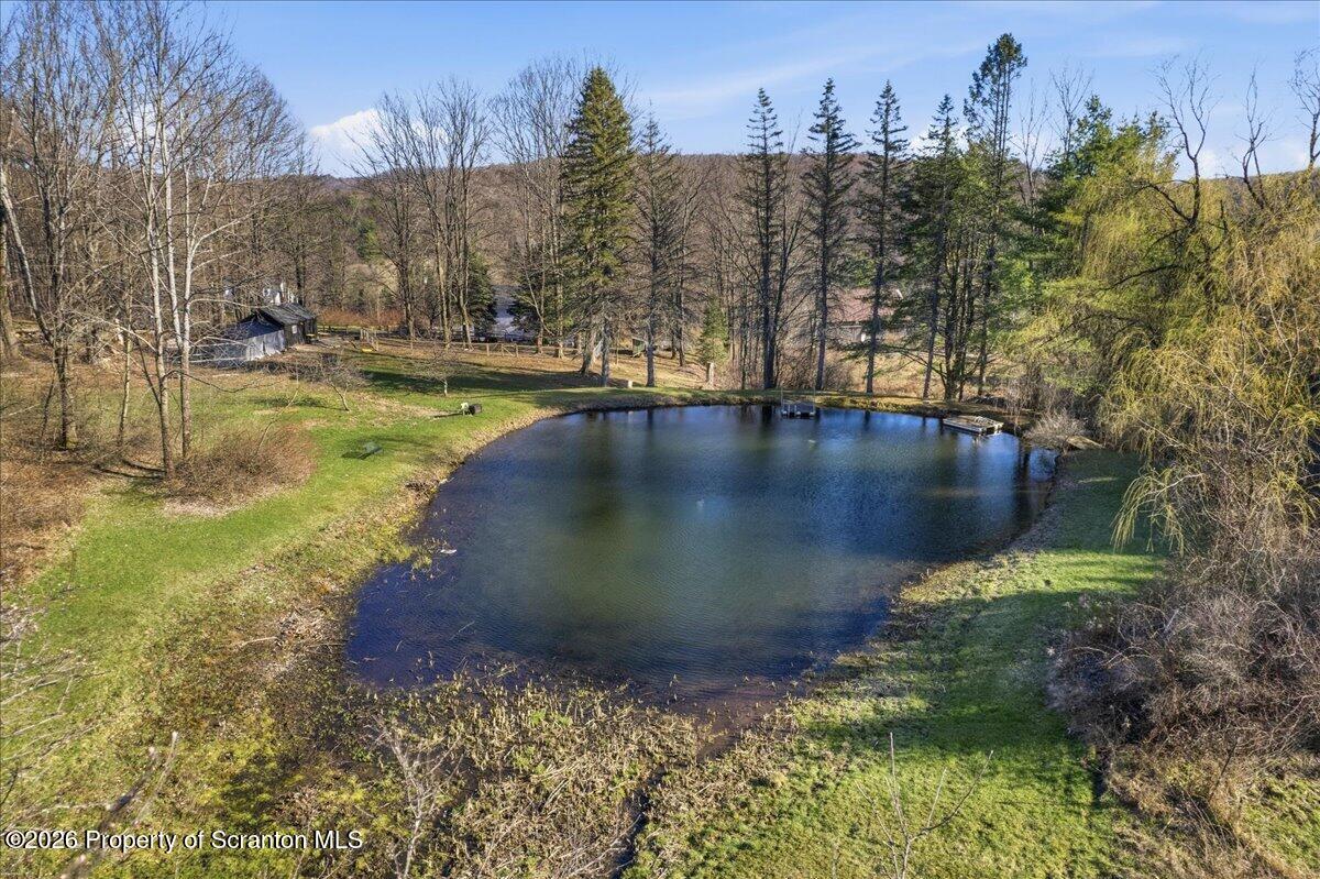 519 Sutton Road New Milford, PA 18834 - Photo 3 of 80 a view of a lake with houses