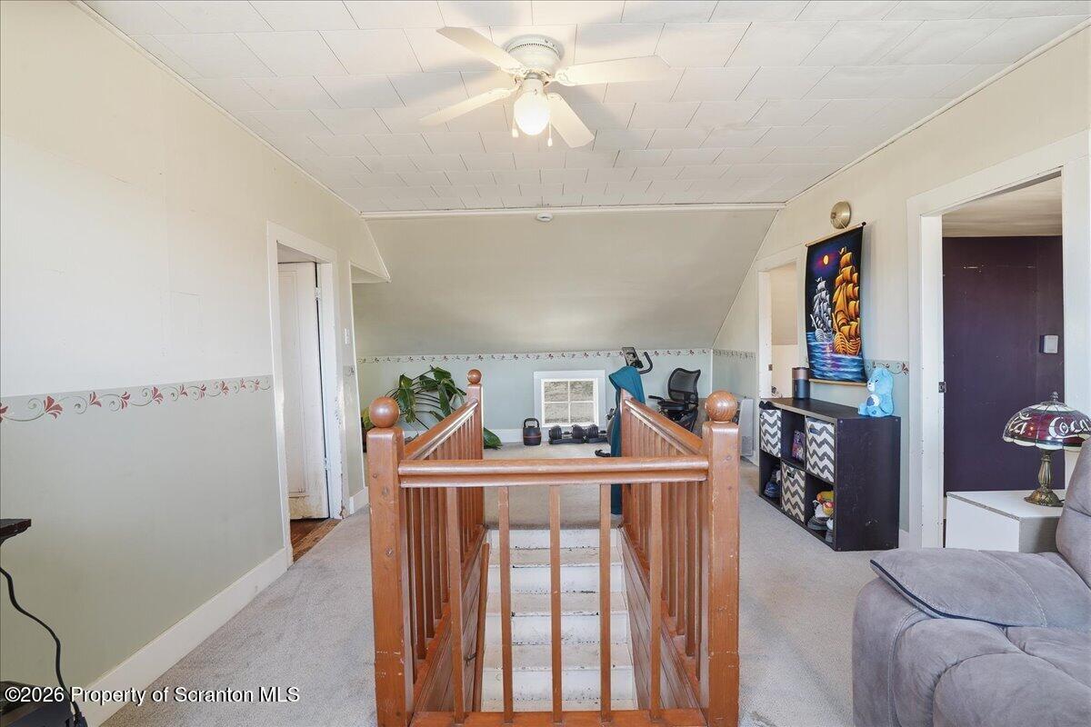 519 Sutton Road New Milford, PA 18834 - Photo 31 of 80 a living room with furniture and a chandelier