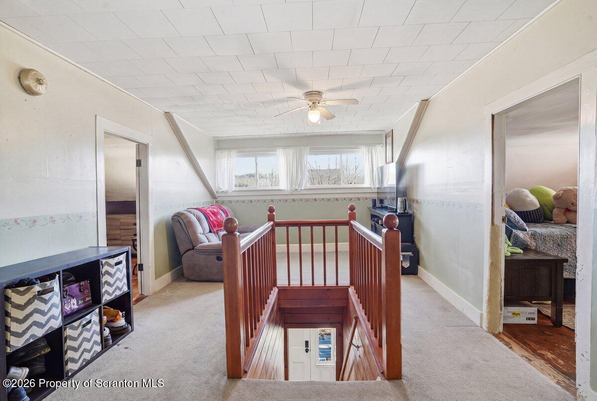 519 Sutton Road New Milford, PA 18834 - Photo 33 of 80 a living room with furniture and a fireplace