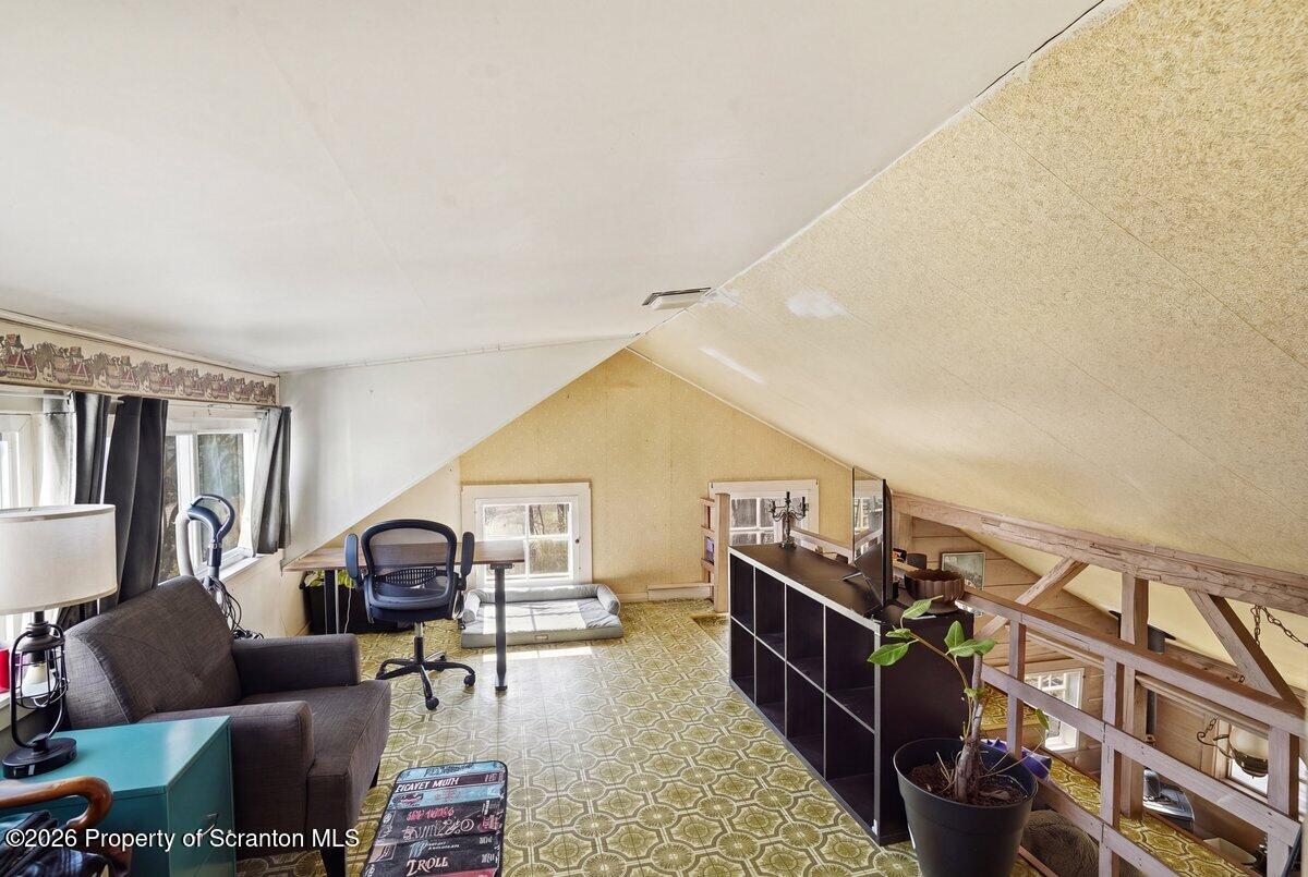 519 Sutton Road New Milford, PA 18834 - Photo 37 of 80 a living room with furniture and a flat screen tv