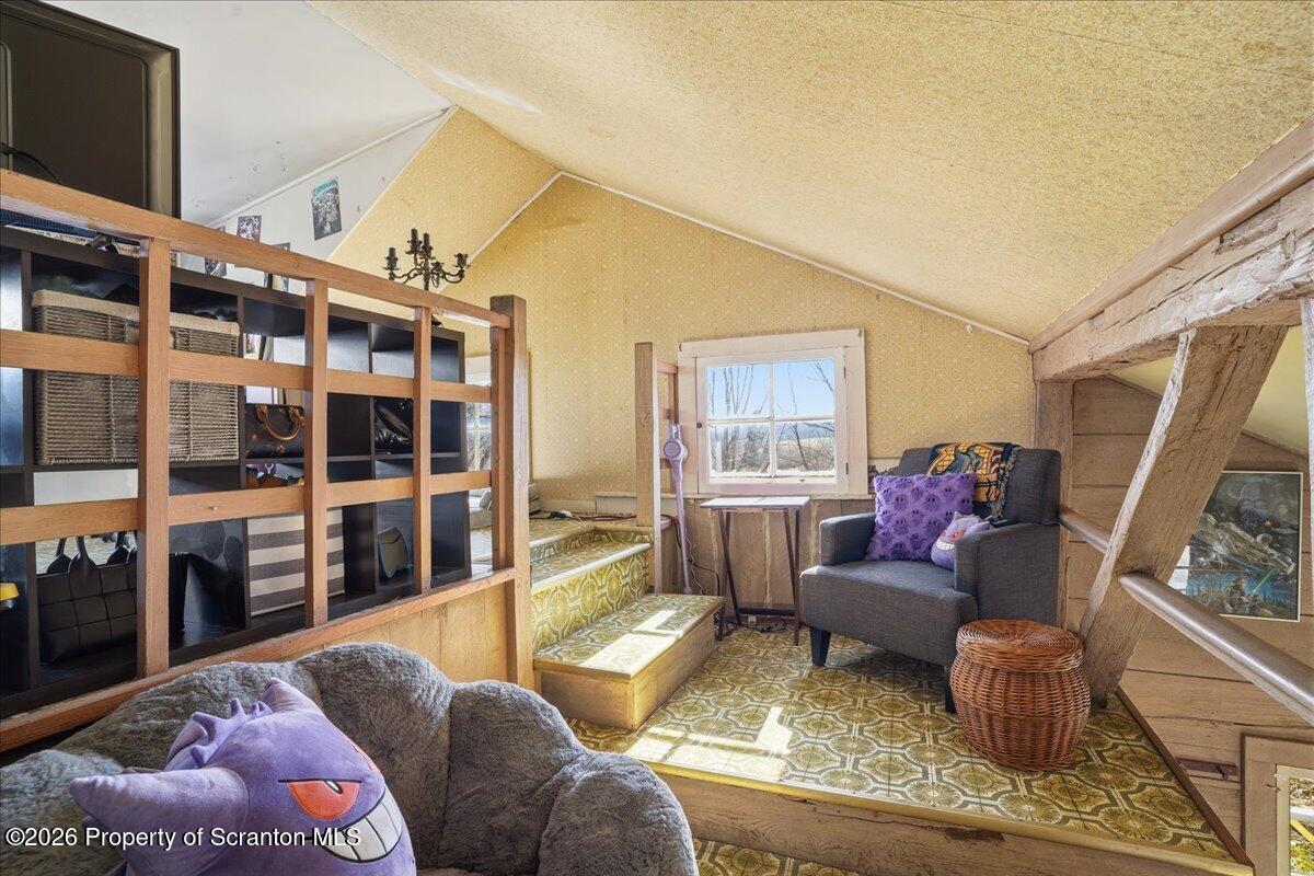 519 Sutton Road New Milford, PA 18834 - Photo 38 of 80 a living room with furniture and a flat screen tv