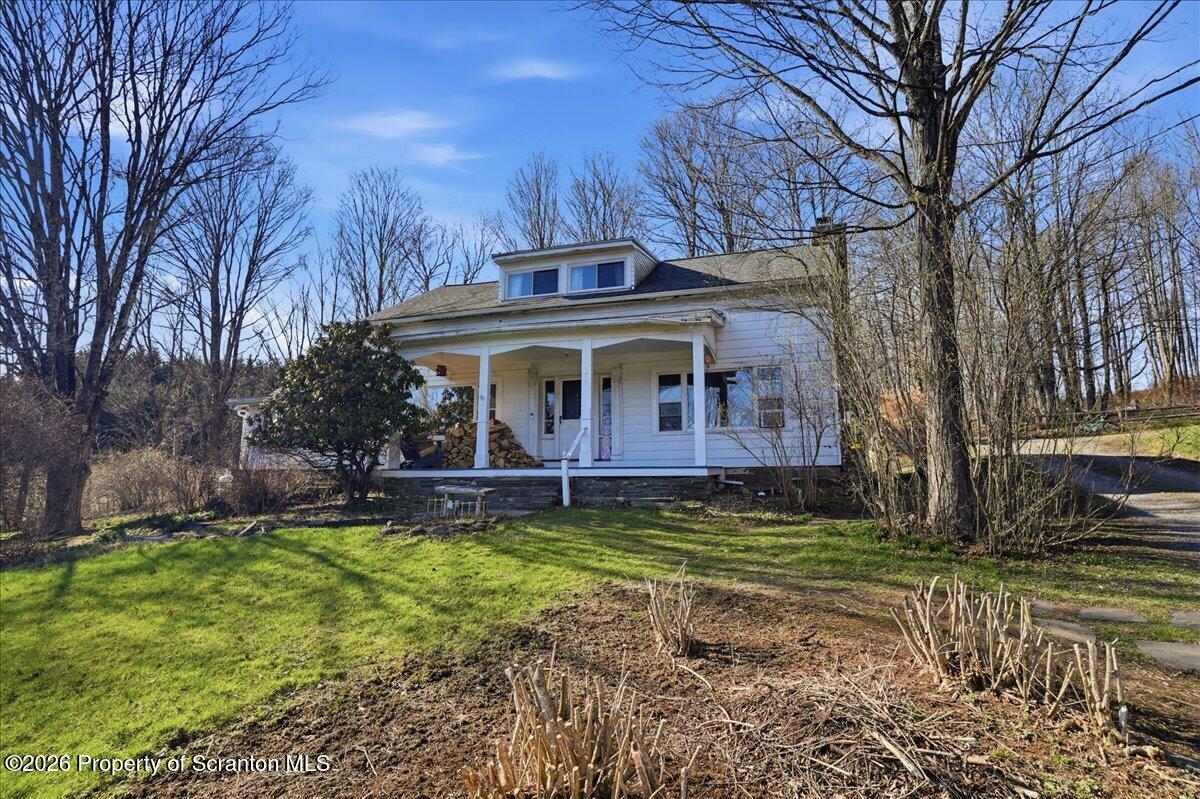519 Sutton Road New Milford, PA 18834 - Photo 5 of 80 a view of a house with a yard