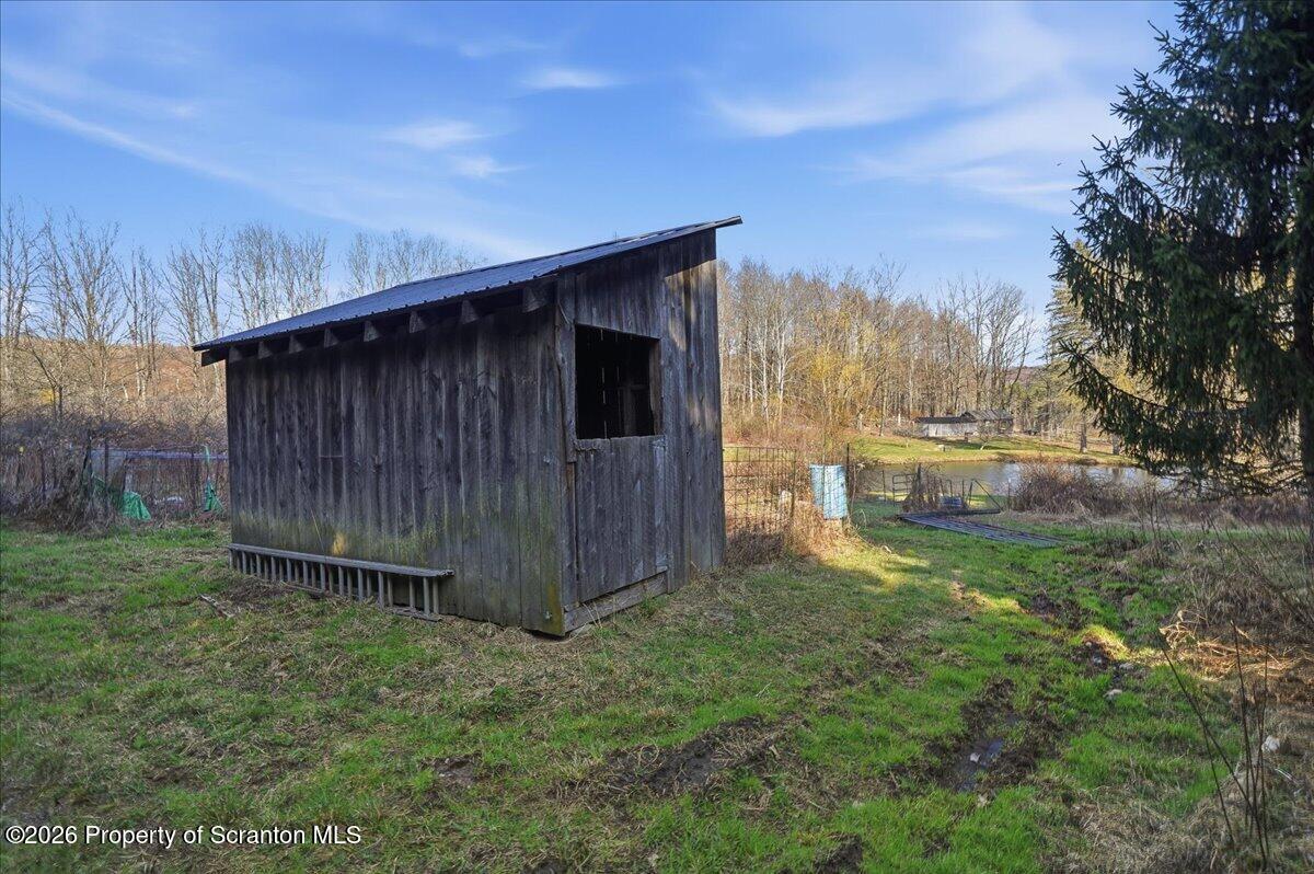 519 Sutton Road New Milford, PA 18834 - Photo 58 of 80 a backyard of a house with lots of green space