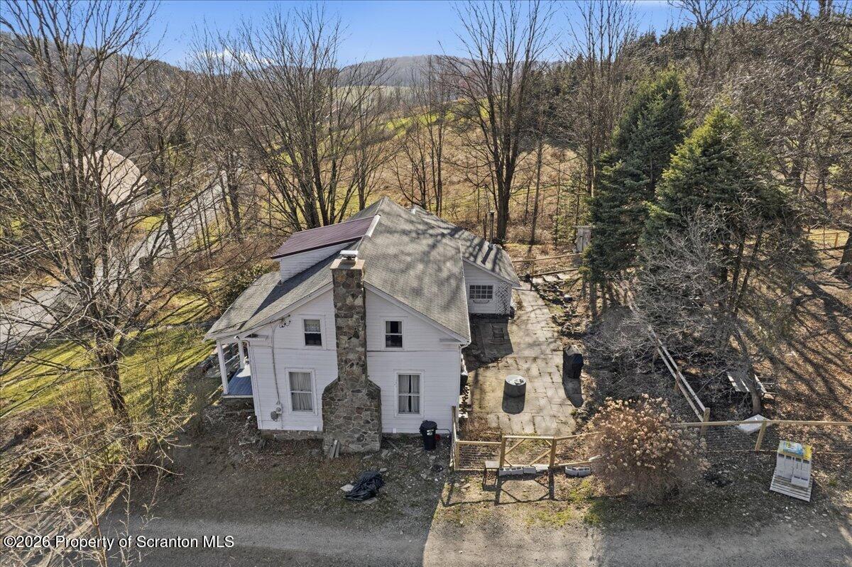 519 Sutton Road New Milford, PA 18834 - Photo 60 of 80 a view of a white house with a yard