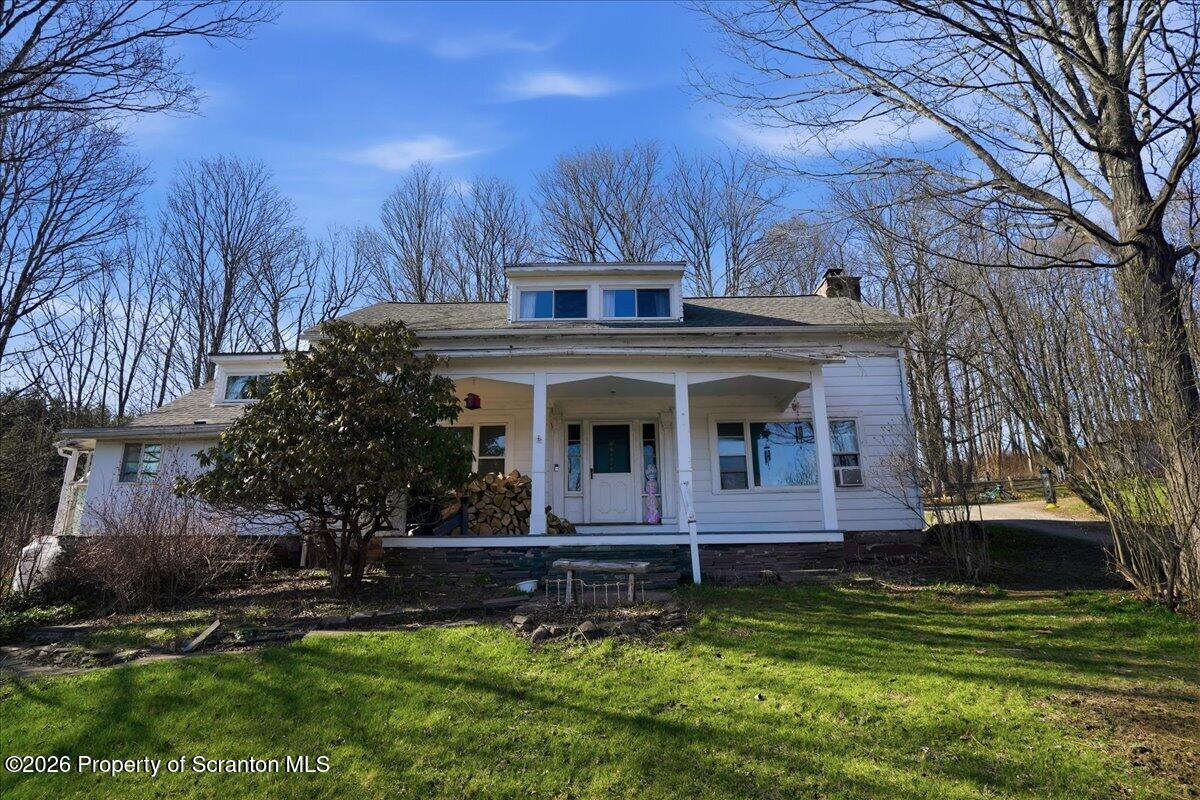 519 Sutton Road New Milford, PA 18834 - Photo 6 of 80 a view of a house with a yard