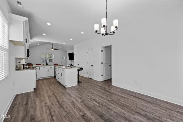 a bedroom with a bed and a ceiling fan