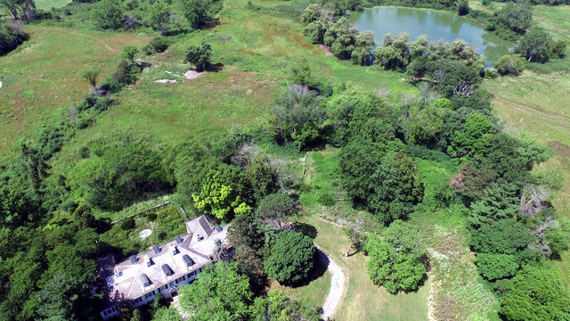 210 South Ridge Road Lake Forest, IL 60045 - Photo 2 of 22 an aerial view of a house with a lush green forest