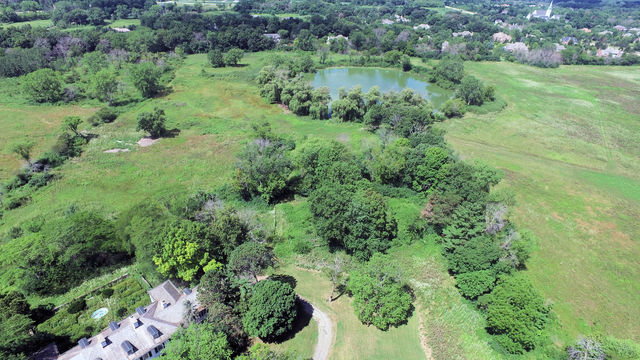 210 South Ridge Road Lake Forest, IL 60045 - Photo 3 of 22 an aerial view of green landscape with trees houses and lake view