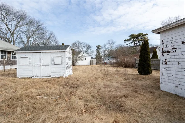 a view of a house with a snow in the background