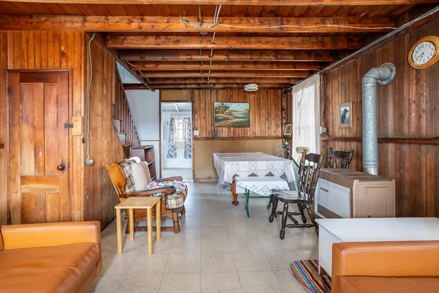 a dining room with furniture and a chandelier