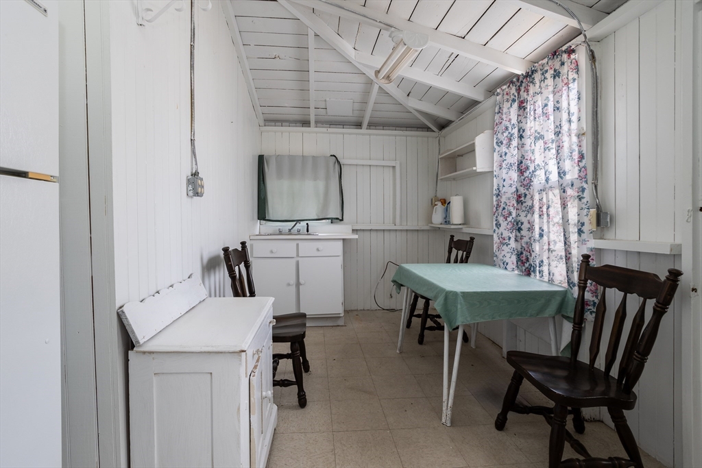 3-5 Crescent Place Wareham, MA 02558 - Photo 16 of 21 a view of a dining room with furniture and a chandelier