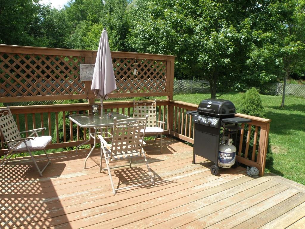 197 Tannery Loop Ellsworth, ME 04605 - Photo 22 of 34 Deck off kitchen- within a large...