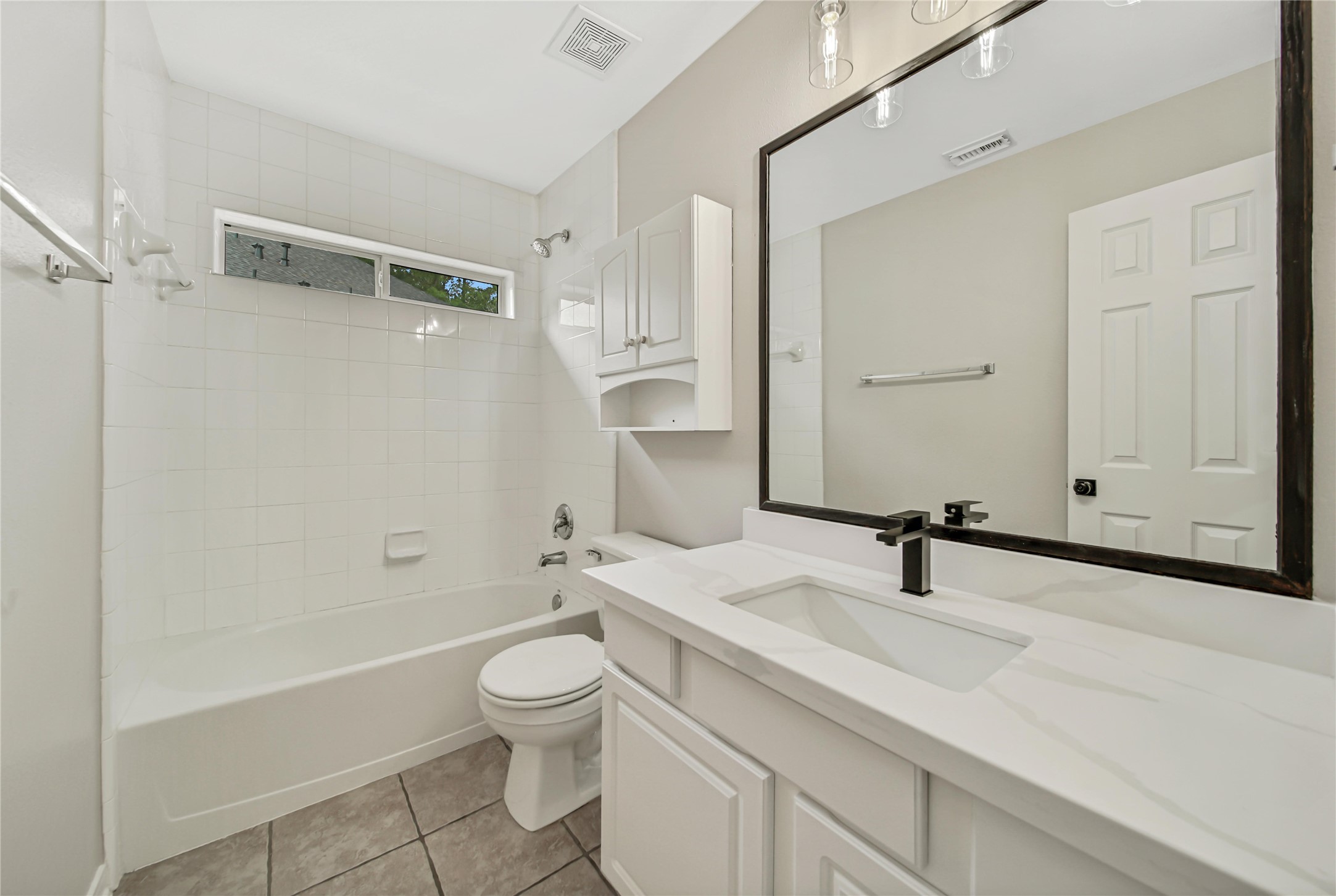 14526 Red Tailed Hawk Lane Houston, TX 77044 - Photo 29 of 40 a bathroom with a sink a toilet and shower