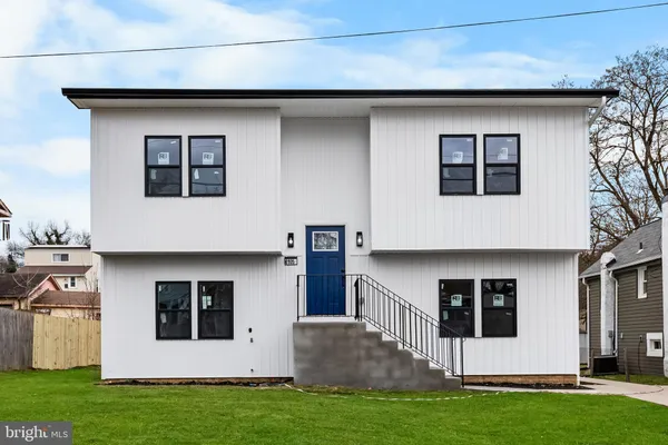 a house that has a big yard in front of it