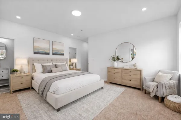 a bed room with two bed and a dresser