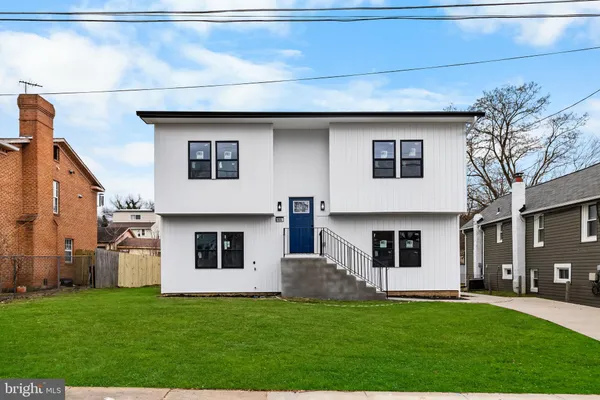 a house that has a big yard in front of it