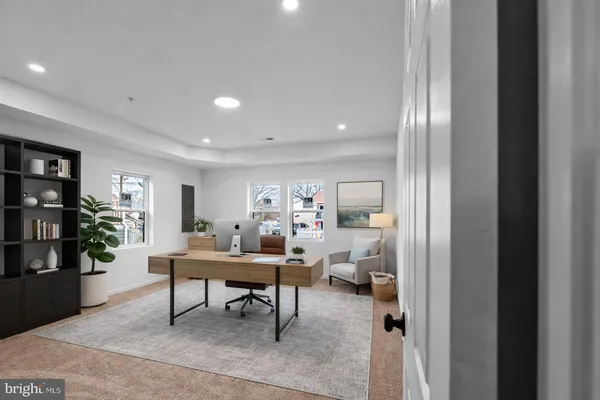 a workspace with furniture and window