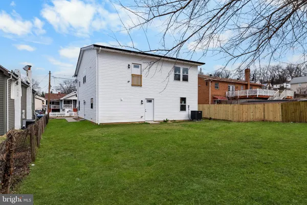 a view of a backyard with plants and a garden