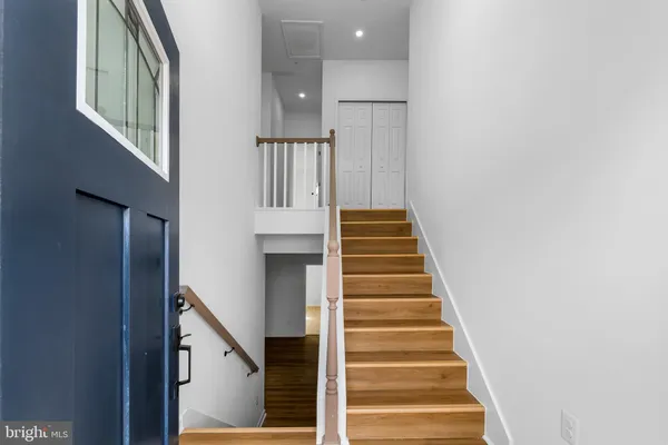 a view of entryway with wooden floor