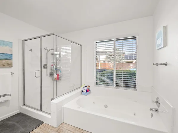 a bathroom with a bathtub and a shower