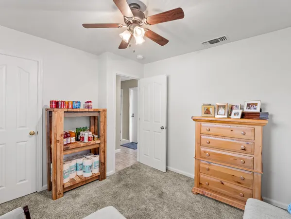 a view of bedroom with furniture and closet