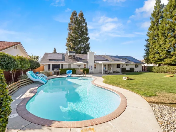 a view of a house with a swimming pool