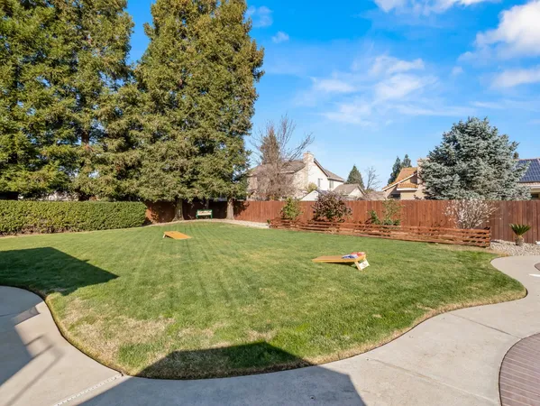 a view of a golf course with a tree