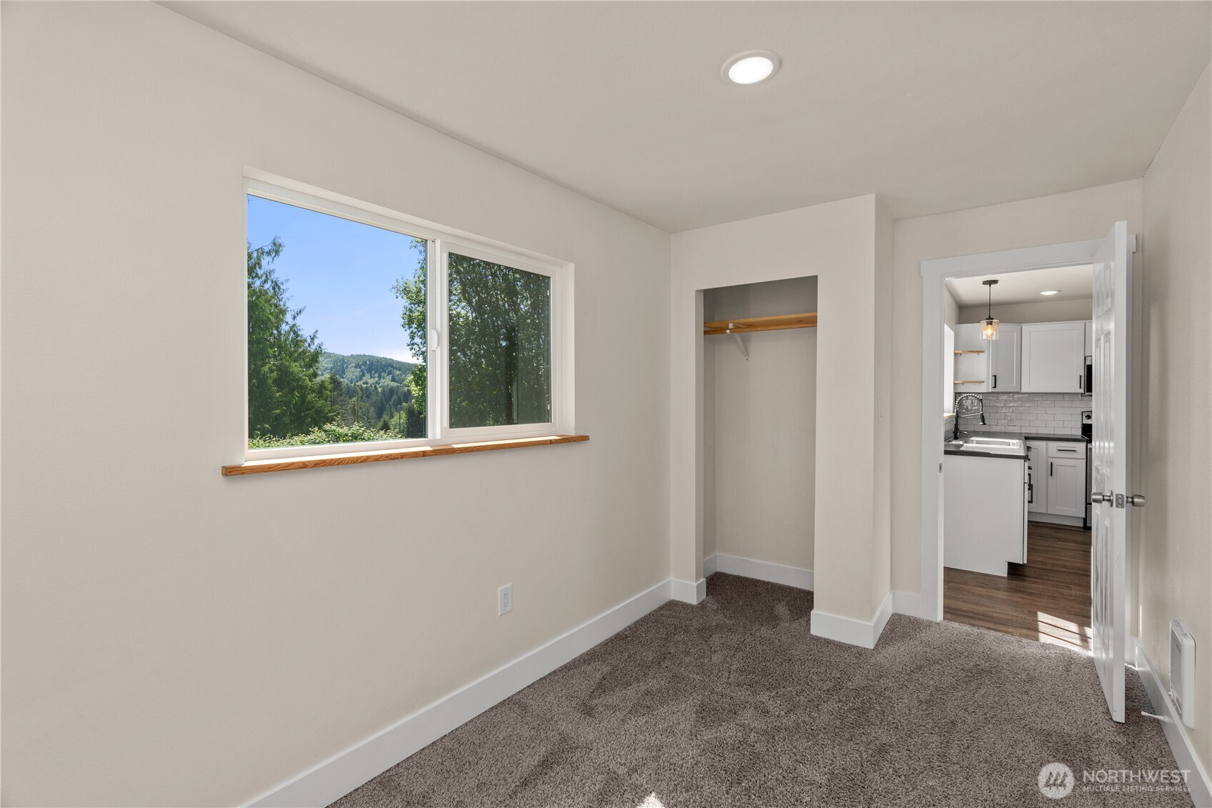 2736 Riverview Drive Aberdeen, WA 98520 - Photo 12 of 40 an empty room with a cabinet and a window