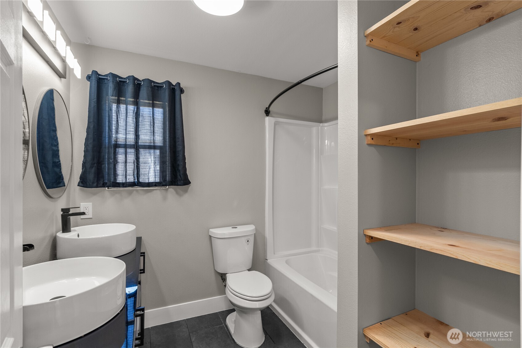 2736 Riverview Drive Aberdeen, WA 98520 - Photo 14 of 40 a bathroom with a toilet sink and mirror