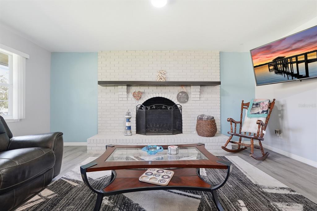 270 Wright Grove Road Oak Hill, FL 32759 - Photo 16 of 17 a living room with furniture and a wooden floor
