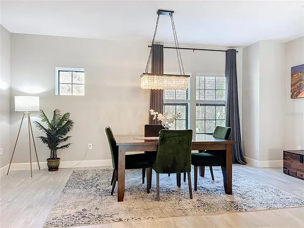 a view of a dining room with furniture and window