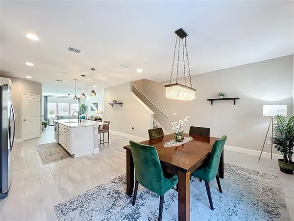 a kitchen with a table and chairs in it