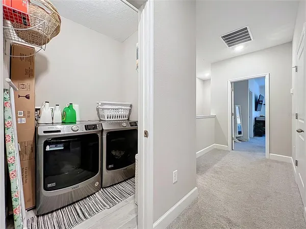 a kitchen with a stove and a refrigerator