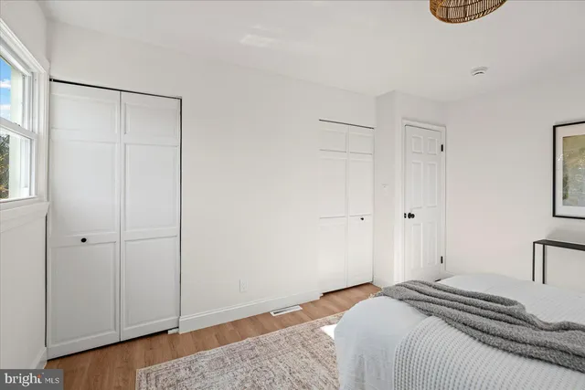 an empty room with wooden floor