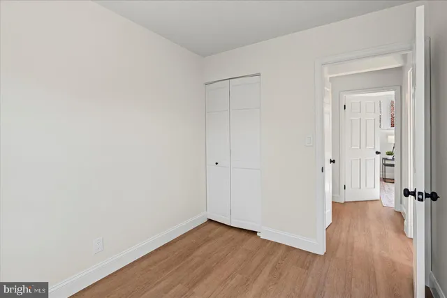 a kitchen with a refrigerator stove and wooden cabinets