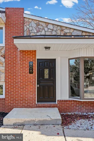 a backyard of apartments with large trees