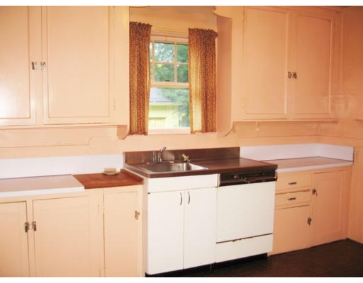 6 Perkins Road Winchester, MA 01890 - Photo 7 of 13 a kitchen with granite countertop cabinets and window