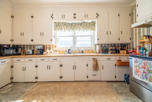 a room with cabinets and window