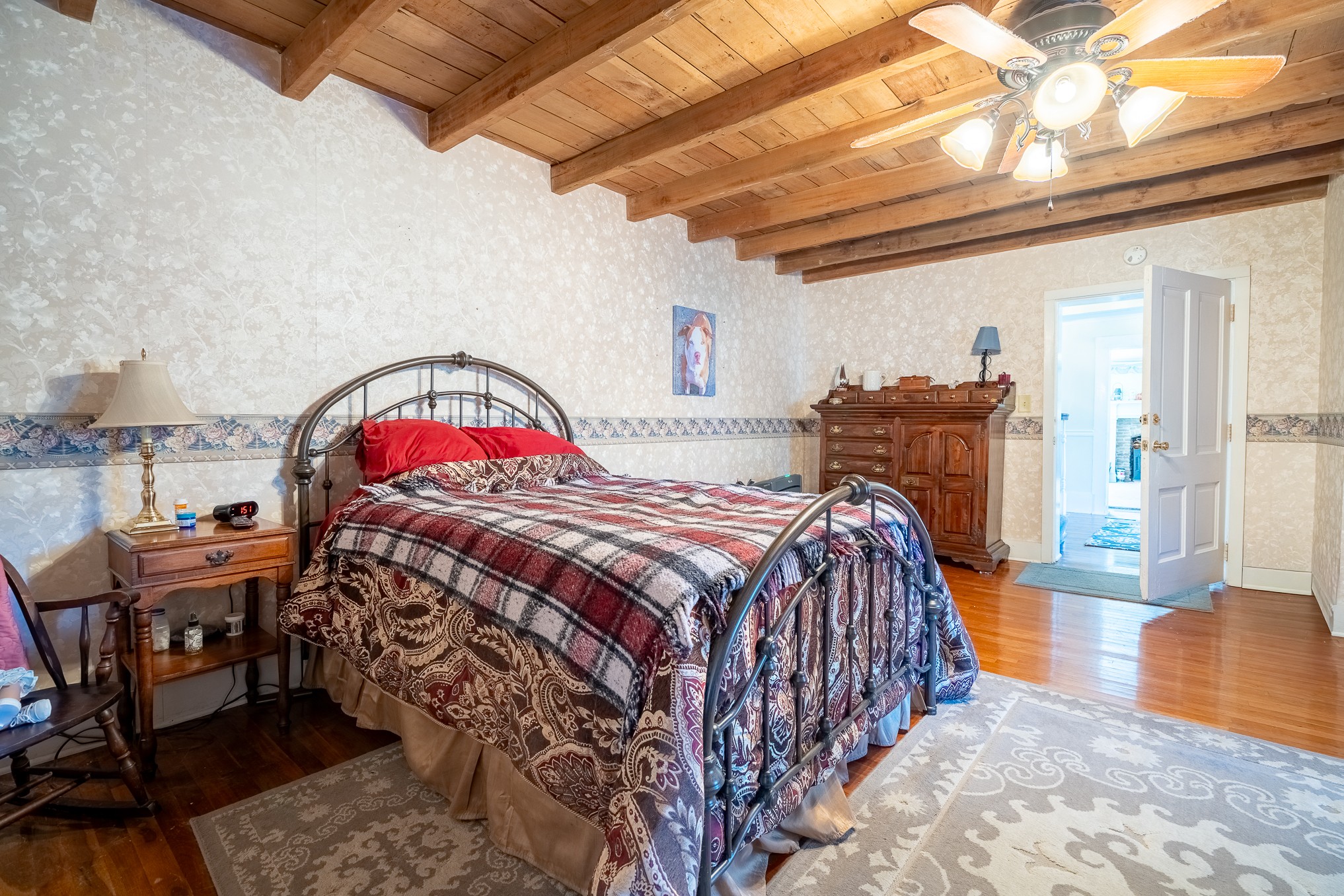 116 Ashland Road Waynesboro, TN 38485 - Photo 29 of 59 a bedroom with a bed and a chandelier