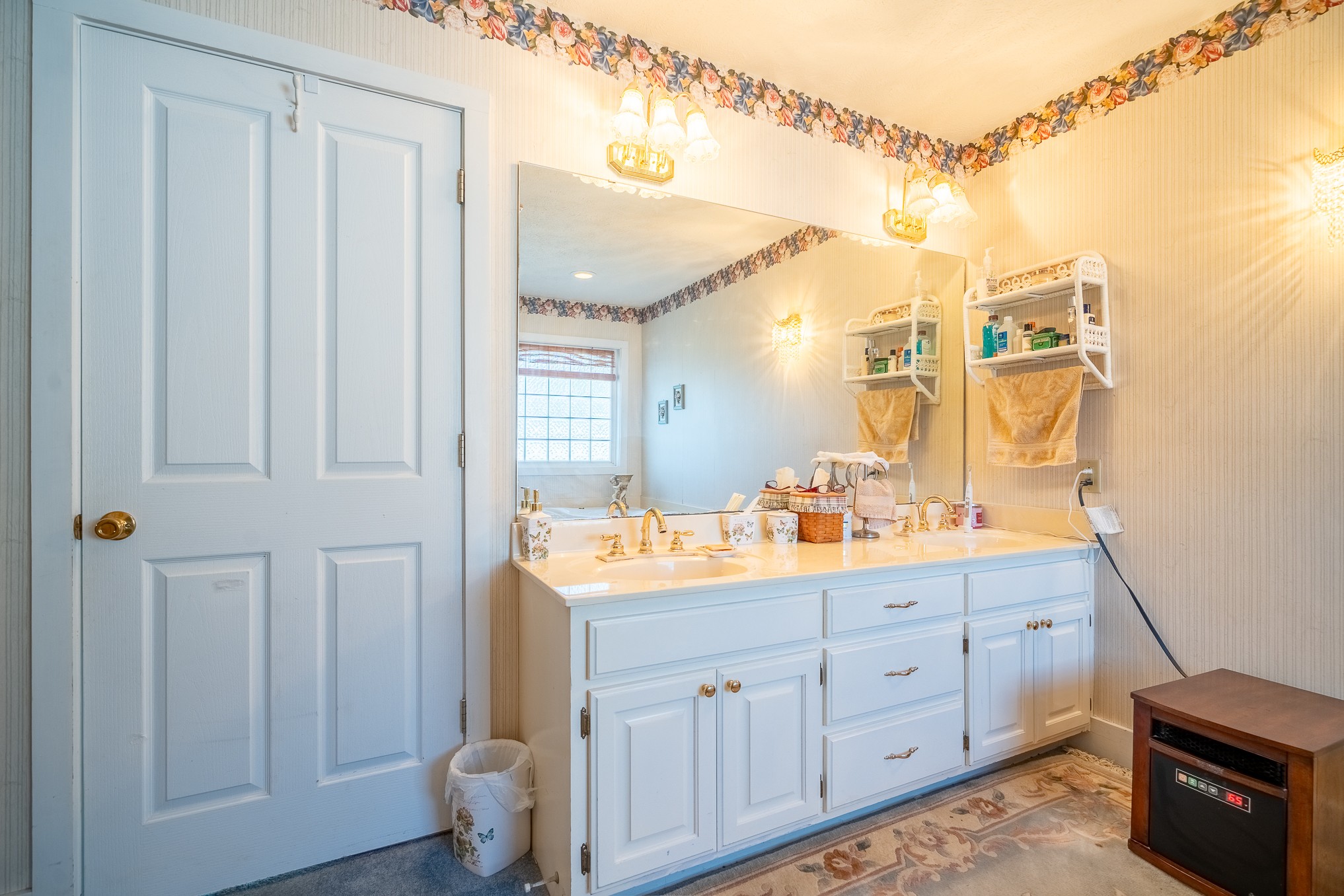 116 Ashland Road Waynesboro, TN 38485 - Photo 32 of 59 a bathroom with a double vanity sink and a mirror