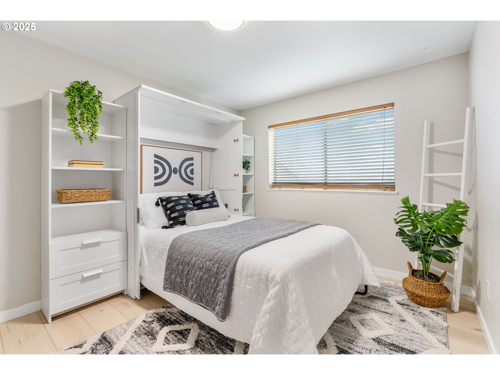 906 Garrison Street The Dalles, OR 97058 - Photo 15 of 25 a bedroom with a bed mirror and window
