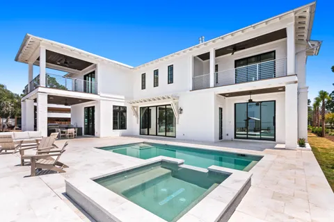 a kitchen with stainless steel appliances a sink stove and cabinets