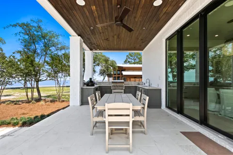 a living room with furniture a window and a chandelier