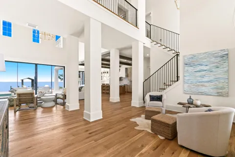 a kitchen with stainless steel appliances granite countertop a stove a sink and white cabinets