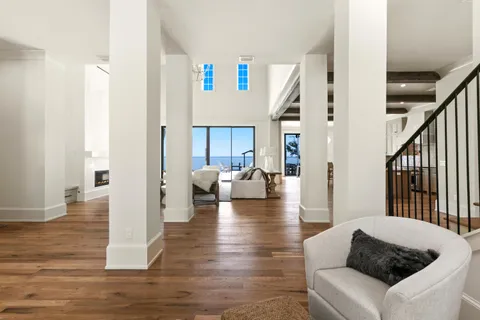a view of a room with wooden floor