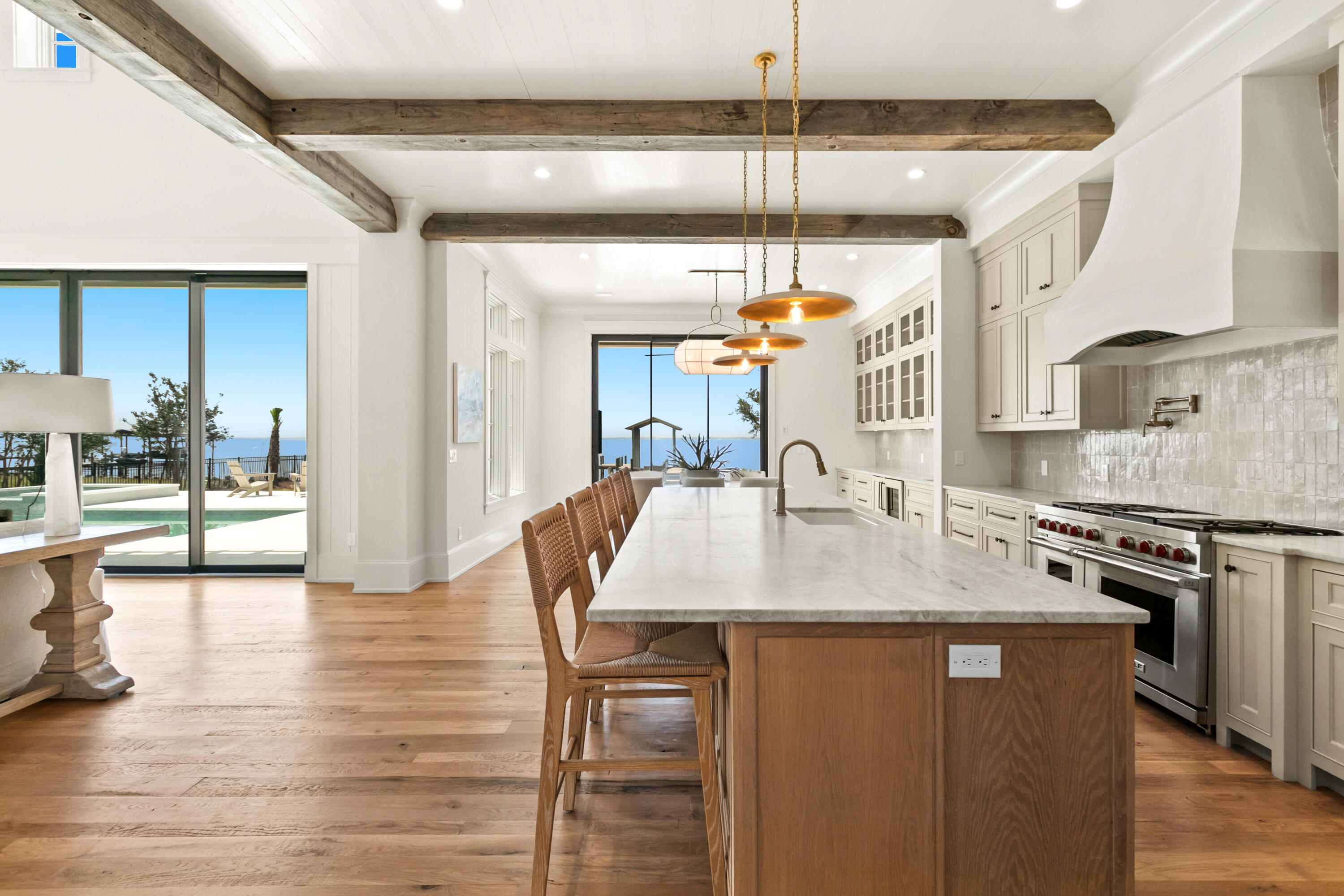 22 Carolyn Lane Santa Rosa Beach, FL 32459 - Photo 33 of 108 a kitchen with stainless steel appliances granite countertop a sink a stove and a wooden floors