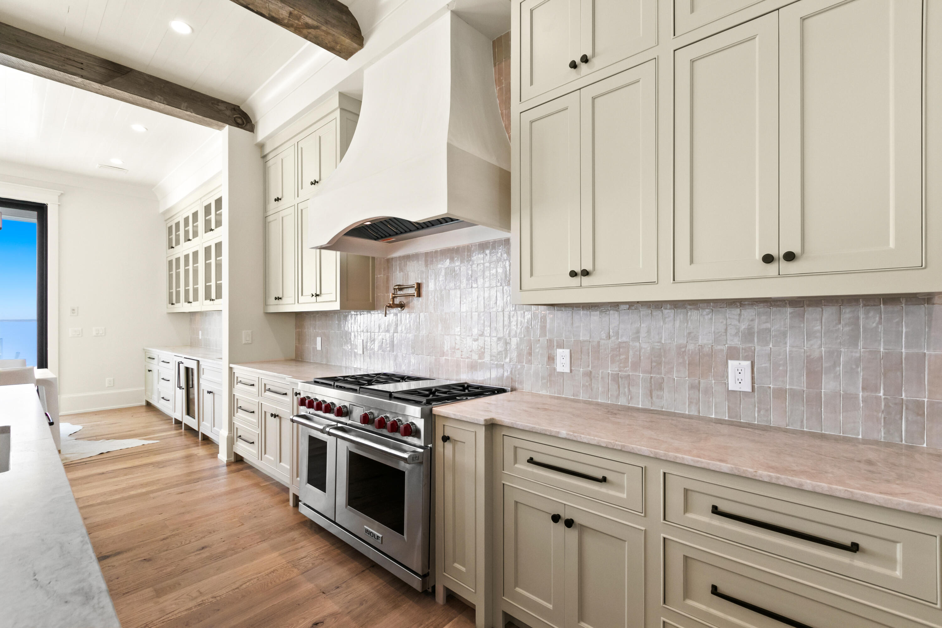22 Carolyn Lane Santa Rosa Beach, FL 32459 - Photo 35 of 108 a kitchen with stainless steel appliances granite countertop a stove a sink and white cabinets
