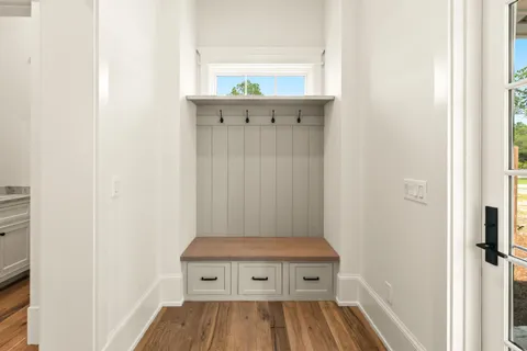 a bathroom with a toilet sink shower and mirror