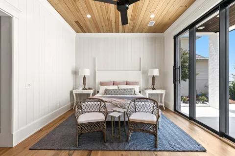 an aerial view of multiple houses with yard