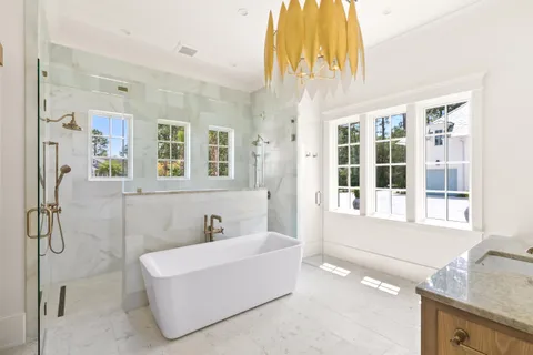 a view of a balcony with wooden floor and barbeque oven